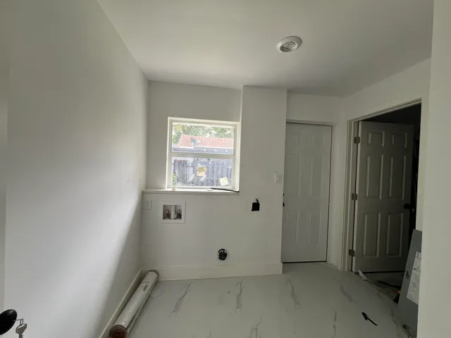 a view of a hallway with closet area