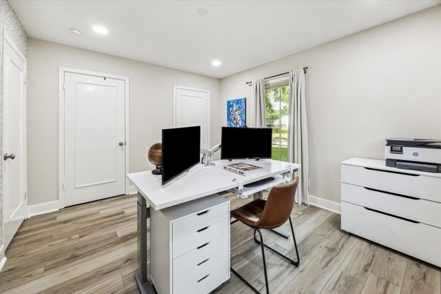 a view of a workspace with furniture