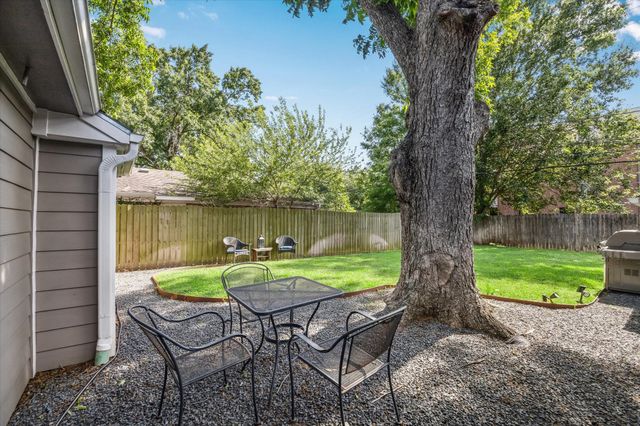 a garden view with a seating space