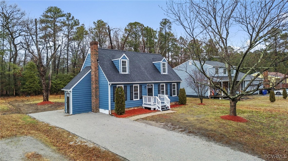 6100 Omo Road Richmond, VA 23234 - Photo 33 of 35 Cape cod house with gravel driveway, a chimney, an