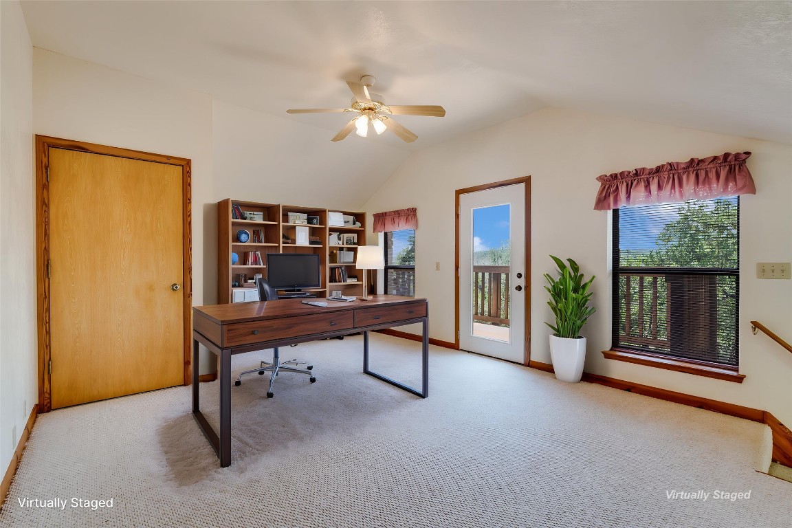 199 Middleton Road Spicewood, TX 78669 - Photo 11 of 39 a view of a workspace with furniture and a window