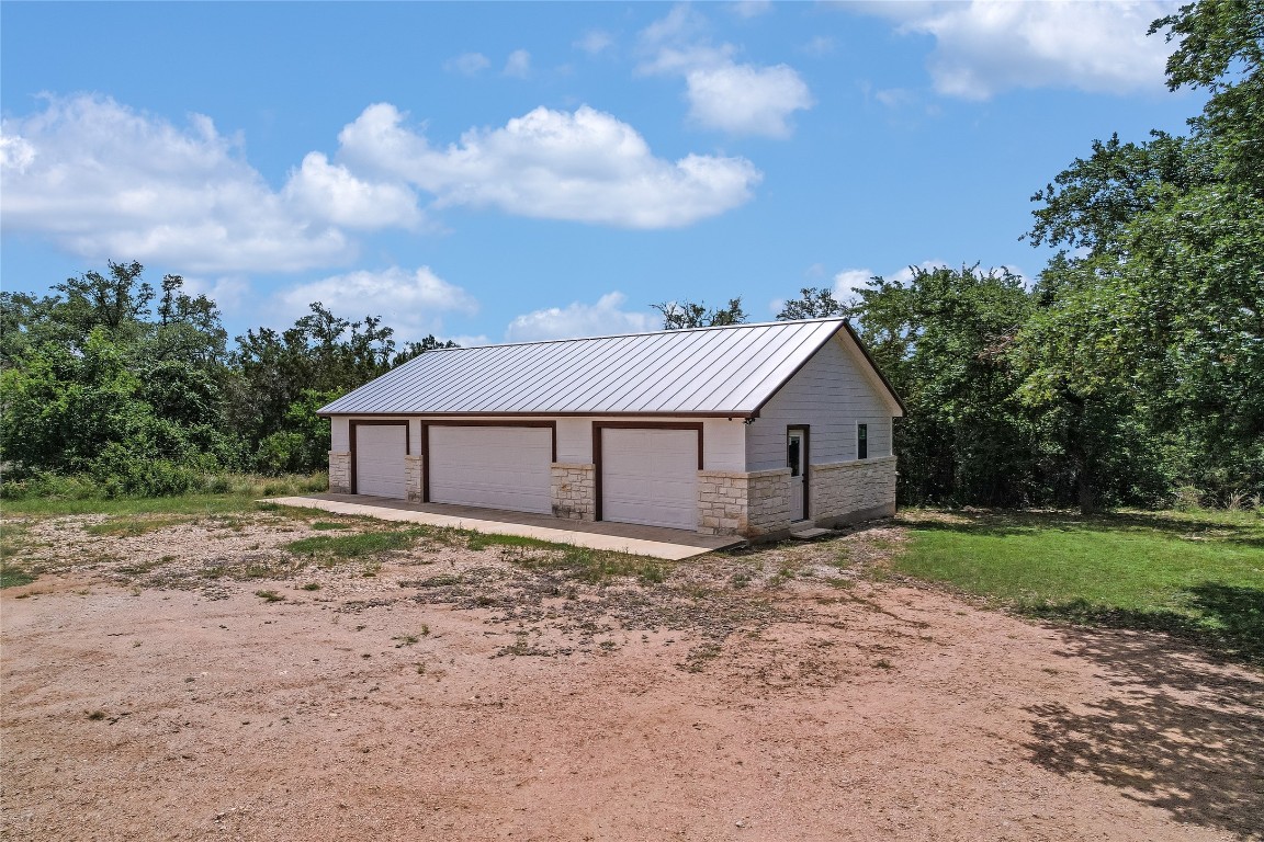 199 Middleton Road Spicewood, TX 78669 - Photo 5 of 39 a view of a house with a yard