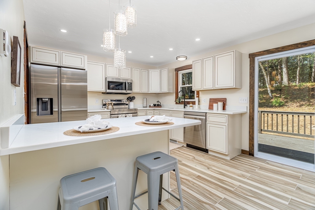 5 Kurikka Road Westminster, MA 01473 - Photo 3 of 38 a kitchen with a sink stainless steel appliances and cabinets