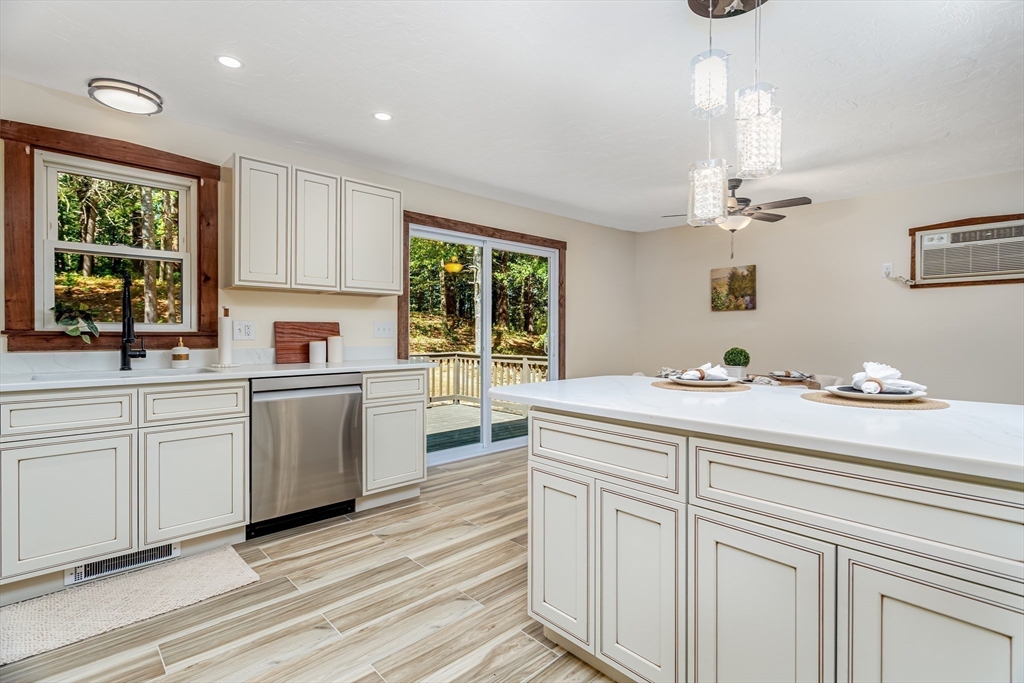 5 Kurikka Road Westminster, MA 01473 - Photo 6 of 38 a kitchen with white cabinets and window
