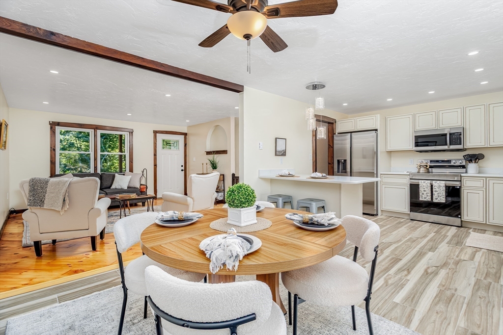 5 Kurikka Road Westminster, MA 01473 - Photo 8 of 38 a view of a dining room with furniture a kitchen and chandelier