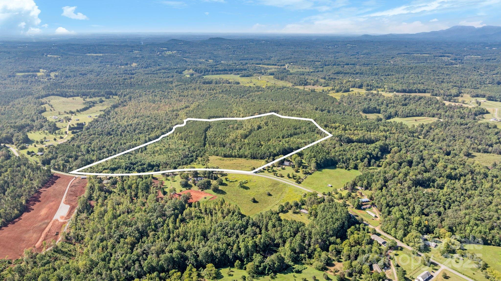 1178 Pea Ridge Road Mill Spring, NC 28756 - Photo 5 of 6 a view of a houses with a lake