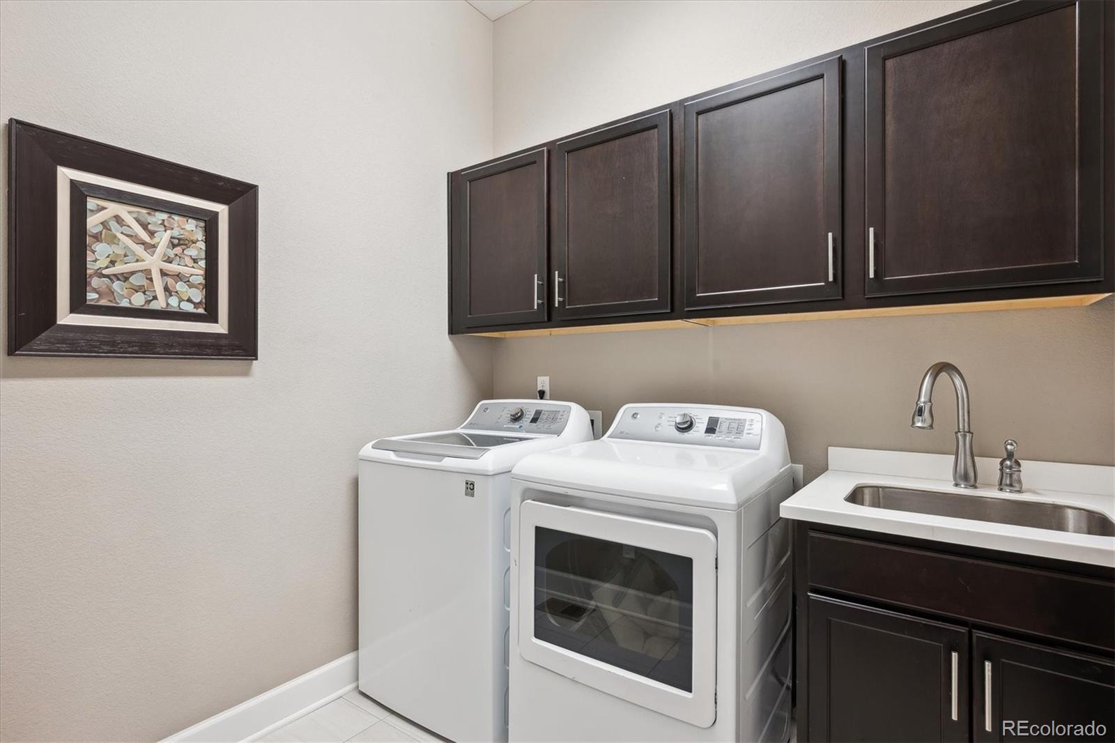 14100 Sierra Ridge Circle Parker, CO 80134 - Photo 23 of 37 a utility room with dryer and washer