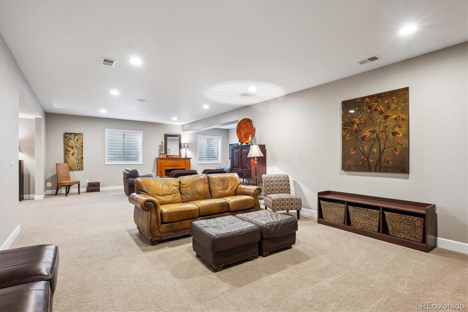 14100 Sierra Ridge Circle Parker, CO 80134 - Photo 27 of 37 a living room with furniture and a flat screen tv