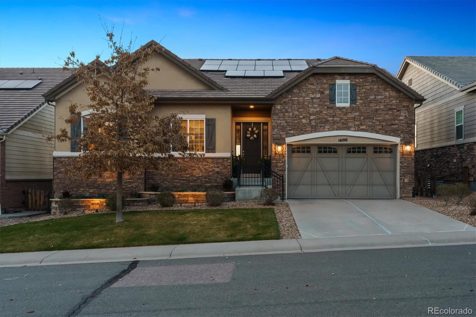 14100 Sierra Ridge Circle Parker, CO 80134 - Photo 35 of 37 a front view of a house with a yard