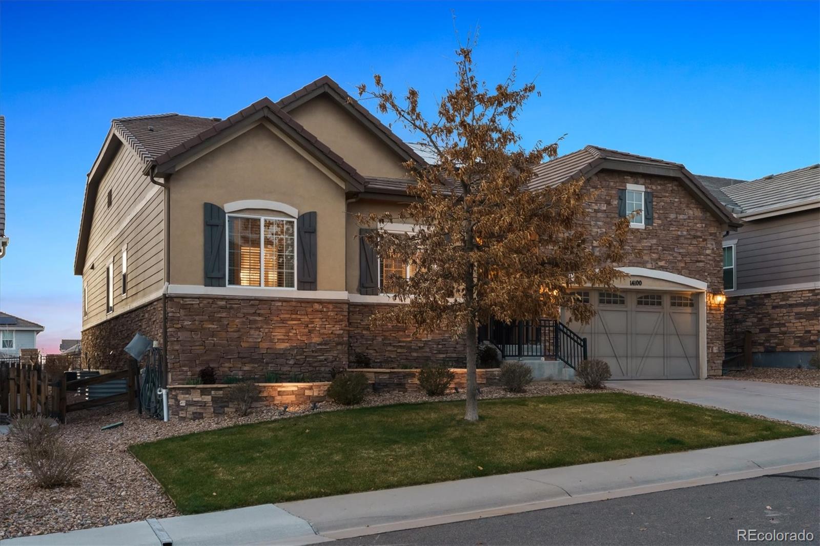 14100 Sierra Ridge Circle Parker, CO 80134 - Photo 36 of 37 a front view of a house with a garden
