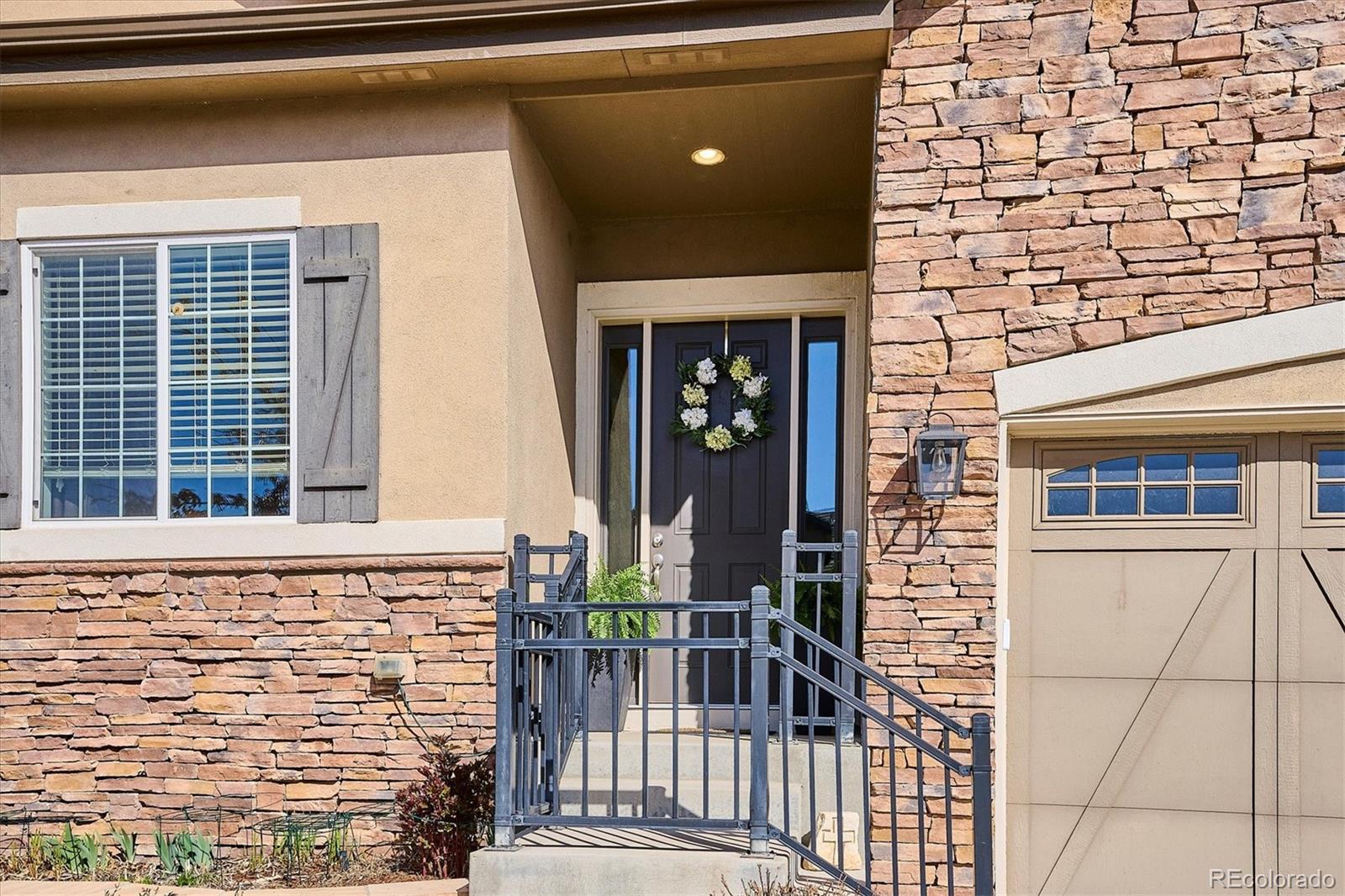 14100 Sierra Ridge Circle Parker, CO 80134 - Photo 37 of 37 a front view of a house with a garage
