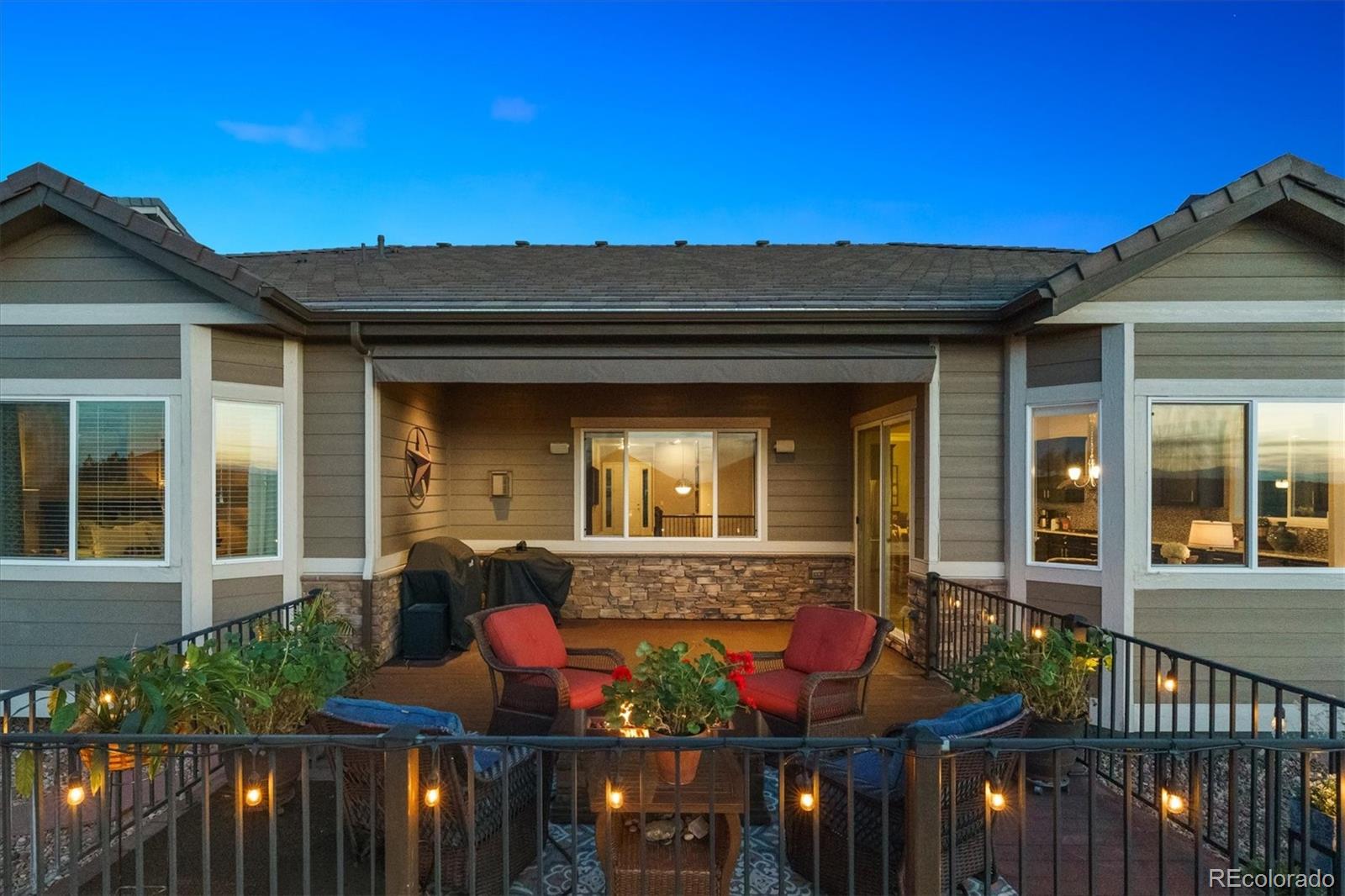 14100 Sierra Ridge Circle Parker, CO 80134 - Photo 4 of 37 front view of a house with a porch