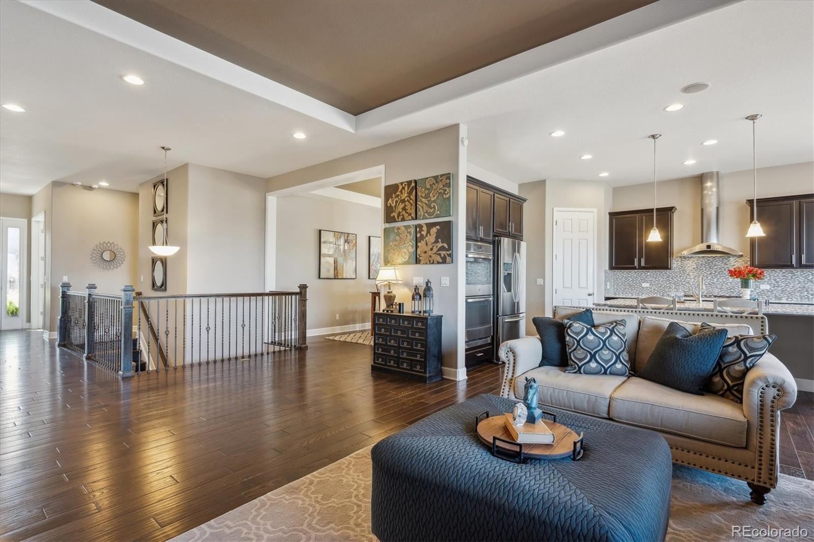 14100 Sierra Ridge Circle Parker, CO 80134 - Photo 7 of 37 a living room with furniture and wooden floor