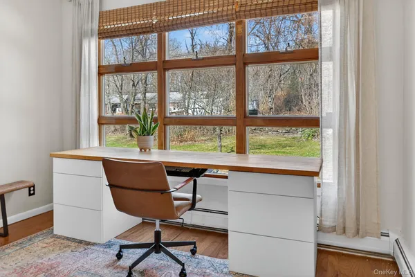 a view of room with window and furniture