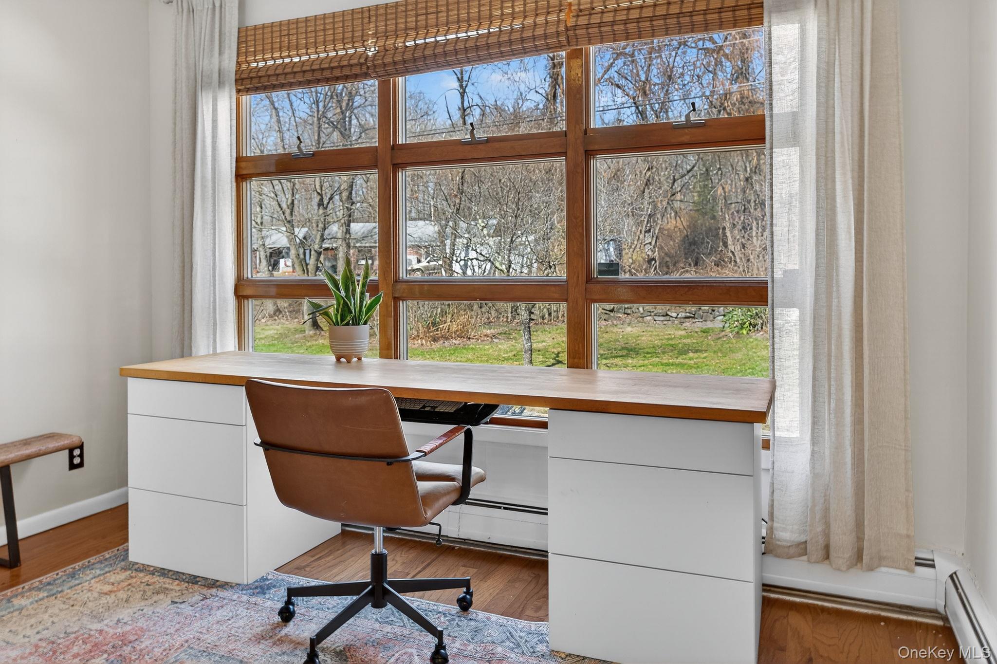 197 Hardenburgh Road Ulster Park, NY 12487 - Photo 19 of 35 a view of a workspace with furniture and a window