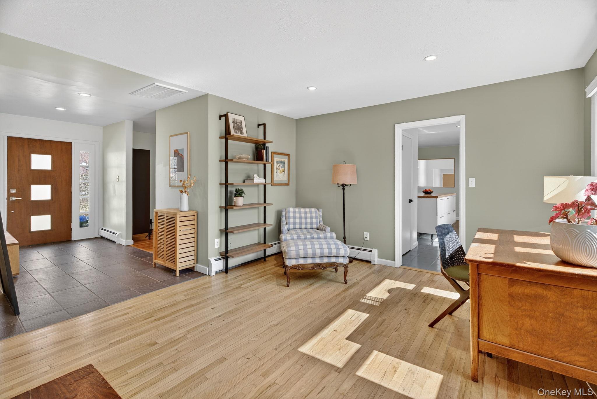 197 Hardenburgh Road Ulster Park, NY 12487 - Photo 21 of 35 a living room with furniture and a wooden floor