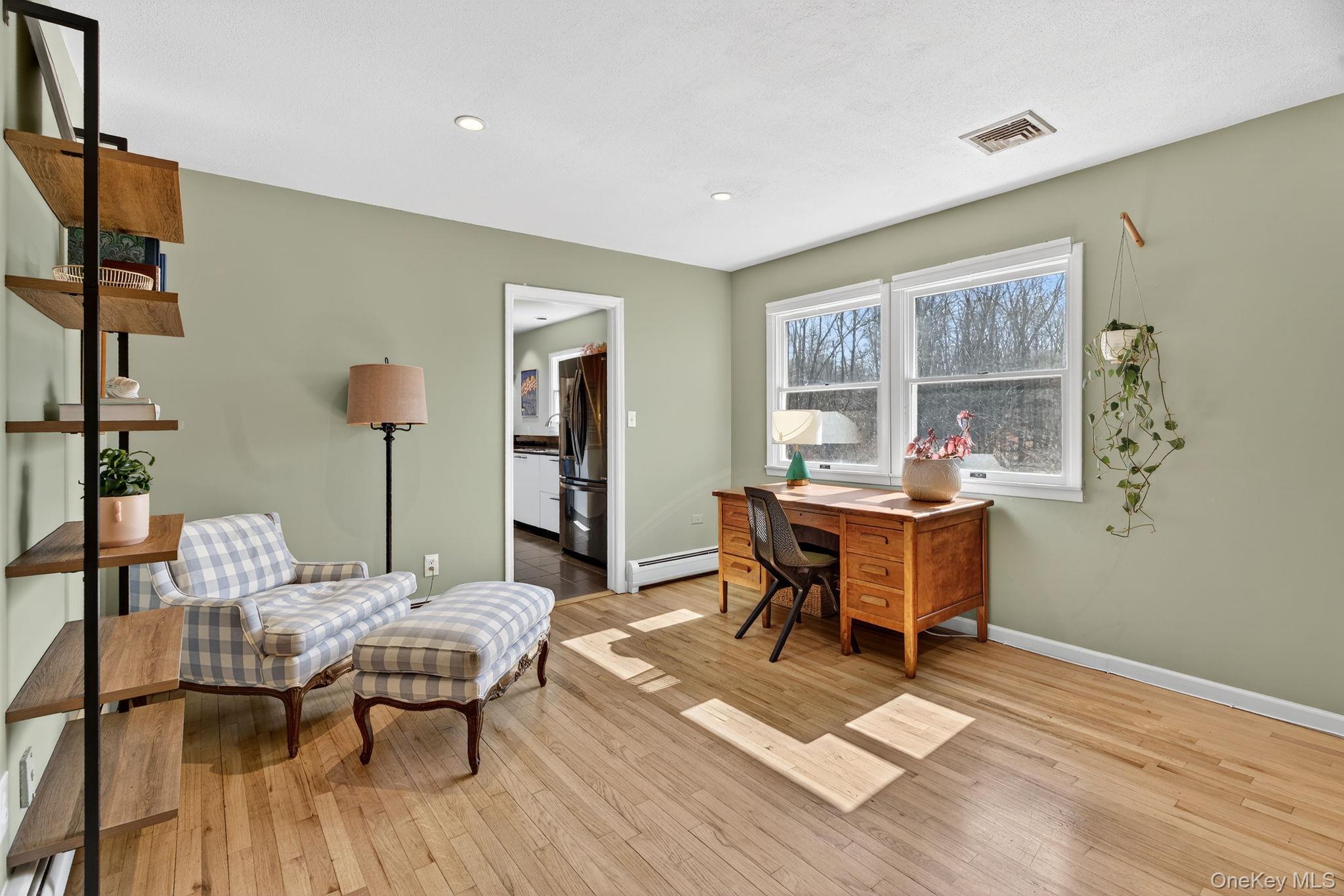 197 Hardenburgh Road Ulster Park, NY 12487 - Photo 22 of 35 a dining room with furniture a rug and wooden floor