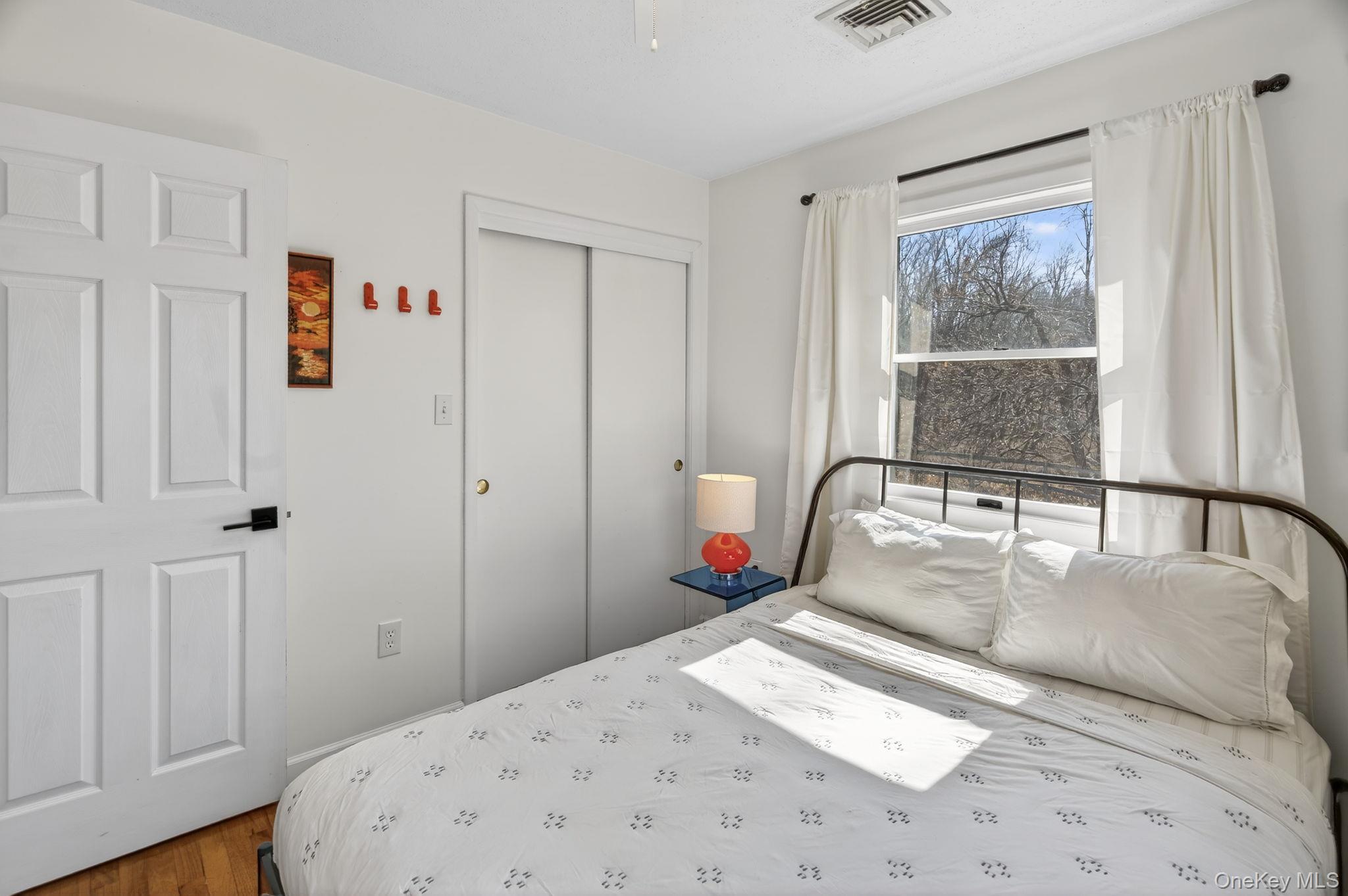 197 Hardenburgh Road Ulster Park, NY 12487 - Photo 28 of 35 a bedroom with a large bed and a window