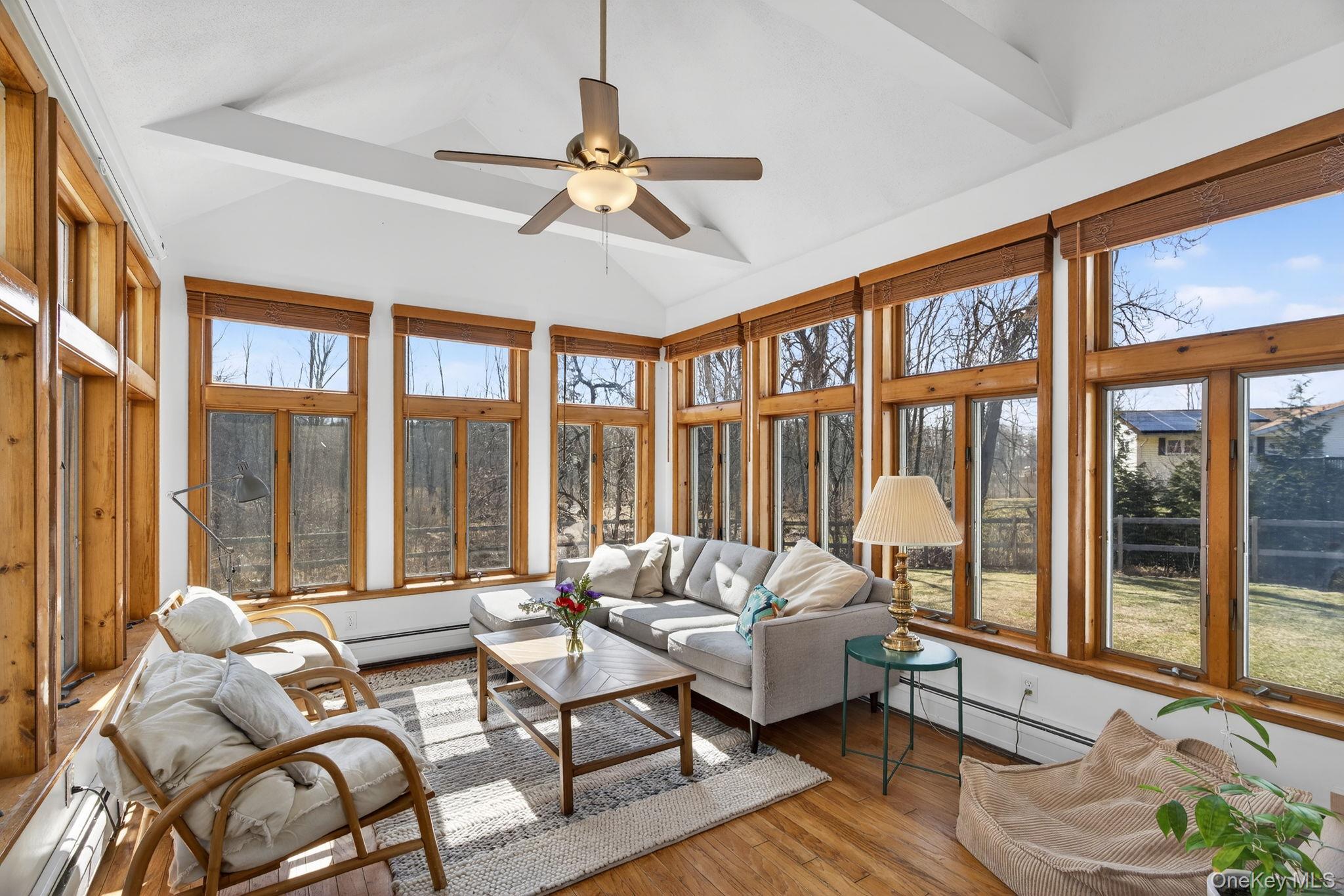 197 Hardenburgh Road Ulster Park, NY 12487 - Photo 4 of 35 a living room with furniture and floor to ceiling windows