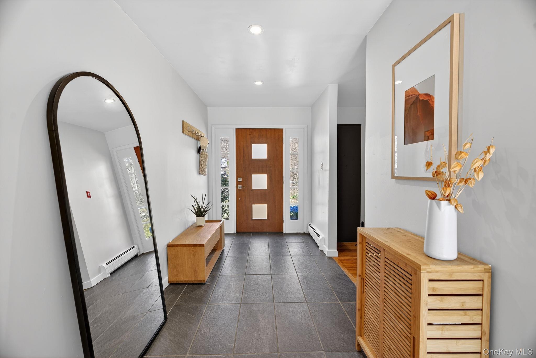 197 Hardenburgh Road Ulster Park, NY 12487 - Photo 6 of 35 a view of an entryway with wooden floor and a mirror