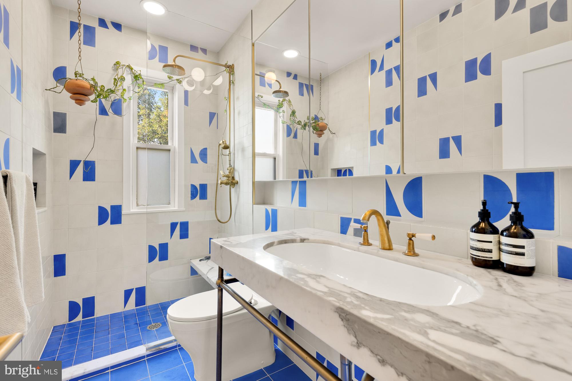 3022 R Street Northwest, Unit 3 Washington, DC 20007 - Photo 19 of 22 a bathroom with a sink a bath tub and a shower