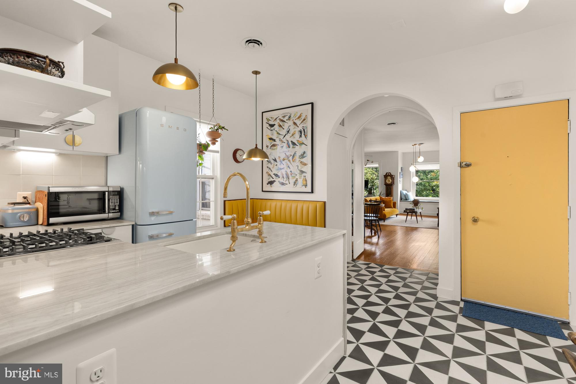 3022 R Street Northwest, Unit 3 Washington, DC 20007 - Photo 3 of 22 a kitchen with granite countertop a sink and a stove top oven