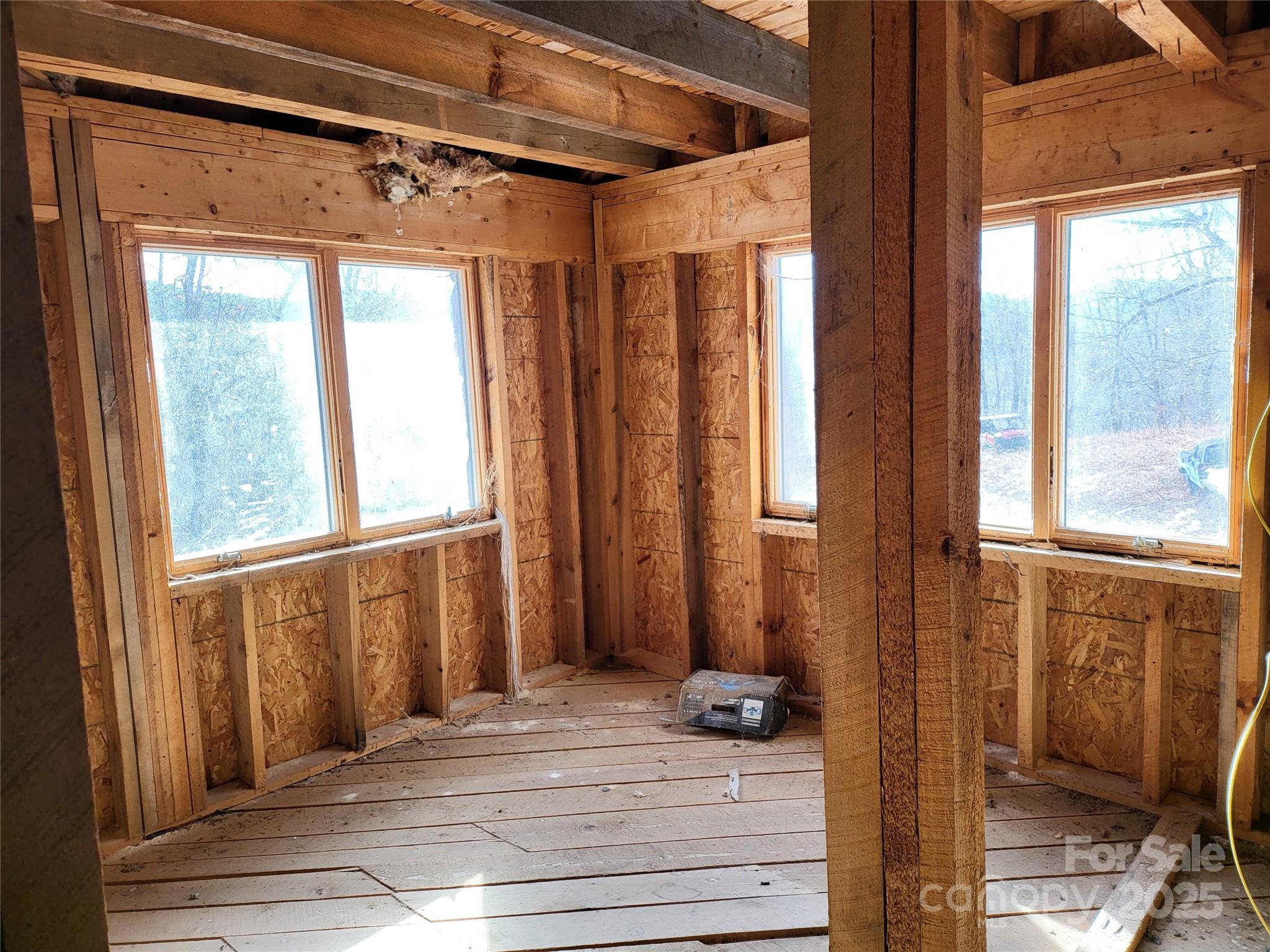 Off Alarka Road Bryson City, NC 28713 - Photo 11 of 43 a view of a bathroom with a window and hardwood floor