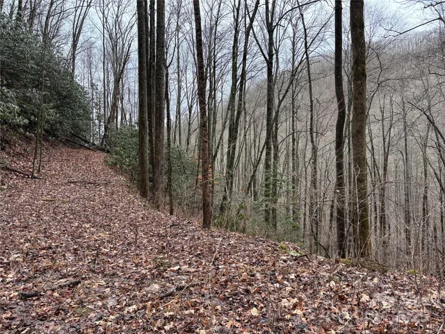 a large building with trees in the background