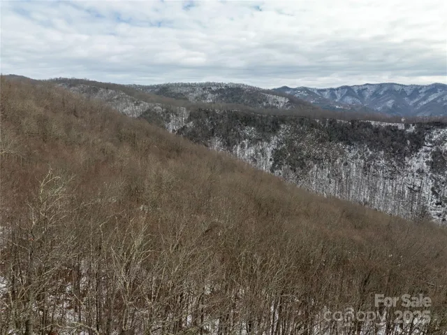 a view of mountains and valleys