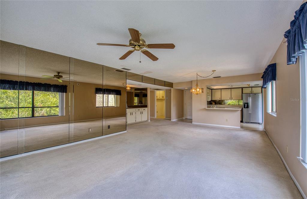 700 Starkey Road, Unit 1145 Largo, FL 33771 - Photo 15 of 63 a view of a livingroom with a fireplace and window
