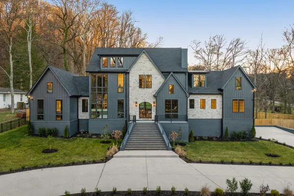 a front view of a house with garden