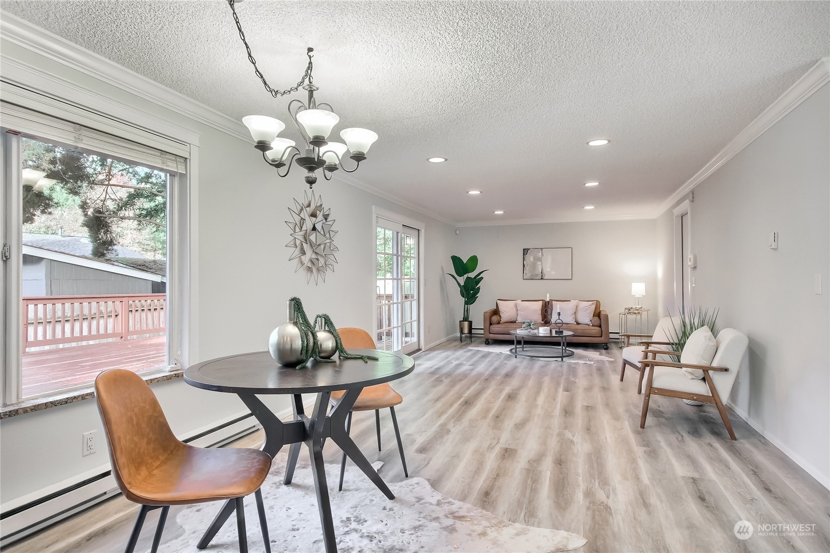 19818 34th Drive Southeast Bothell, WA 98012 - Photo 11 of 34 a view of a dining room with furniture wooden floor and chandelier