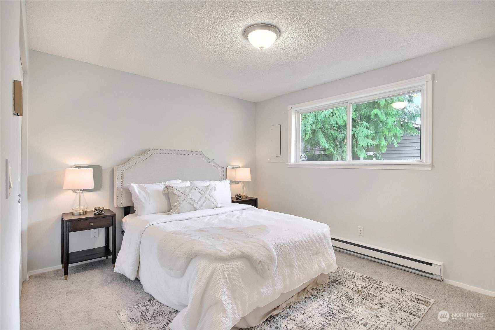 19818 34th Drive Southeast Bothell, WA 98012 - Photo 16 of 34 a bedroom with a bed and a window