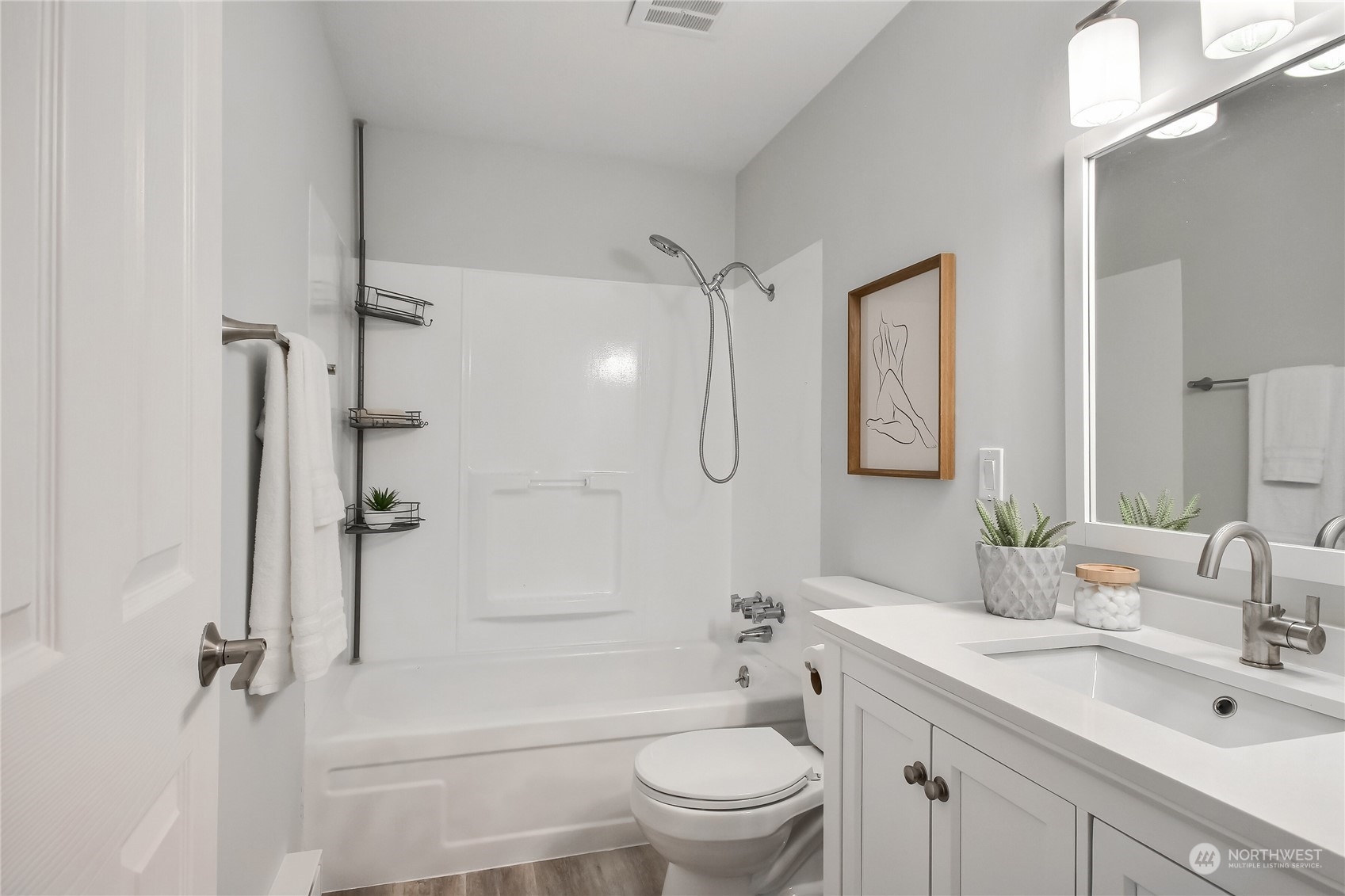19818 34th Drive Southeast Bothell, WA 98012 - Photo 18 of 34 a bathroom with a sink a toilet and shower