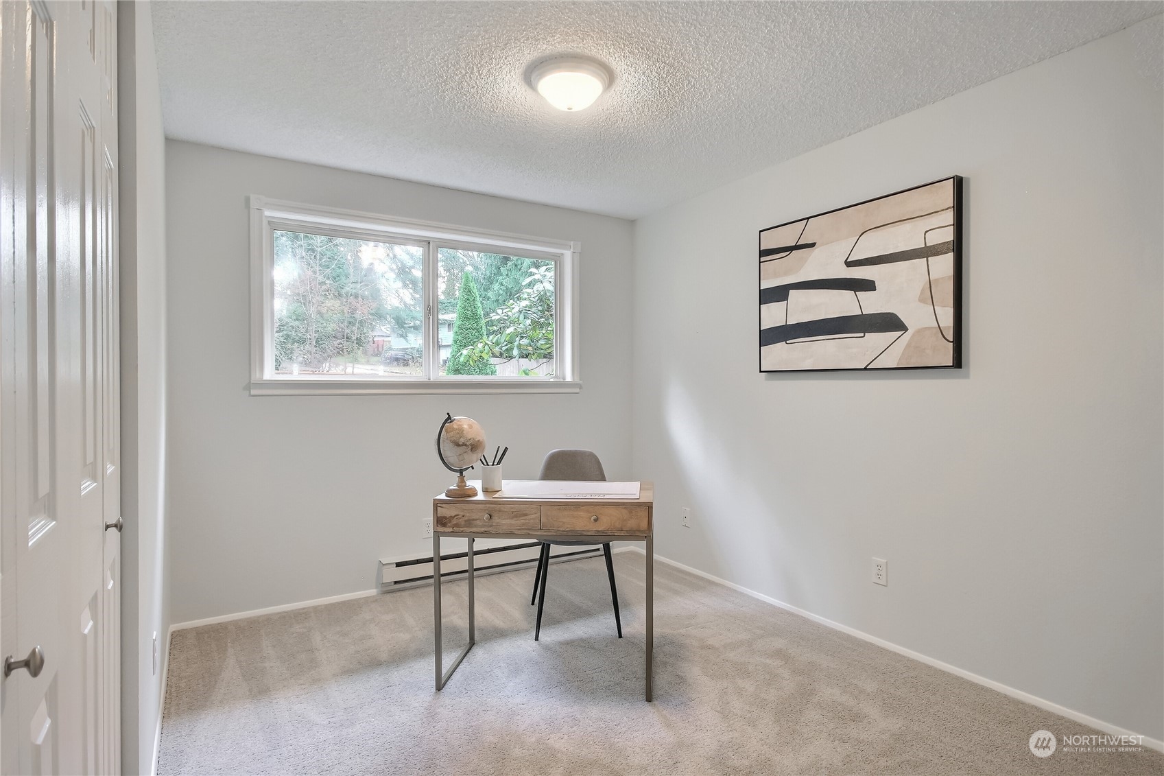 19818 34th Drive Southeast Bothell, WA 98012 - Photo 20 of 34 a workspace with furniture and a window