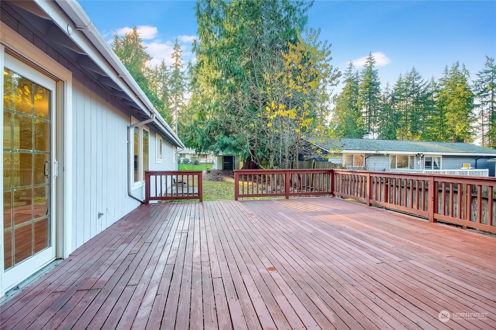 19818 34th Drive Southeast Bothell, WA 98012 - Photo 27 of 34 a view of a deck with wooden floor and fence with a large garden