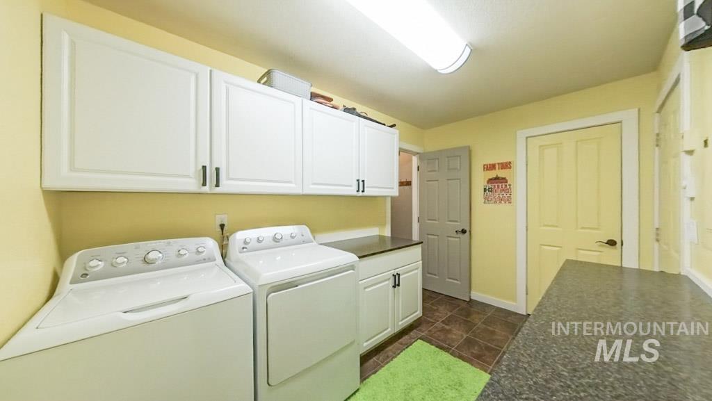 1277 Kennedy Ford Road Potlatch, ID 83855 - Photo 16 of 49 Laundry room featuring independent washer and dryer and cabinet space