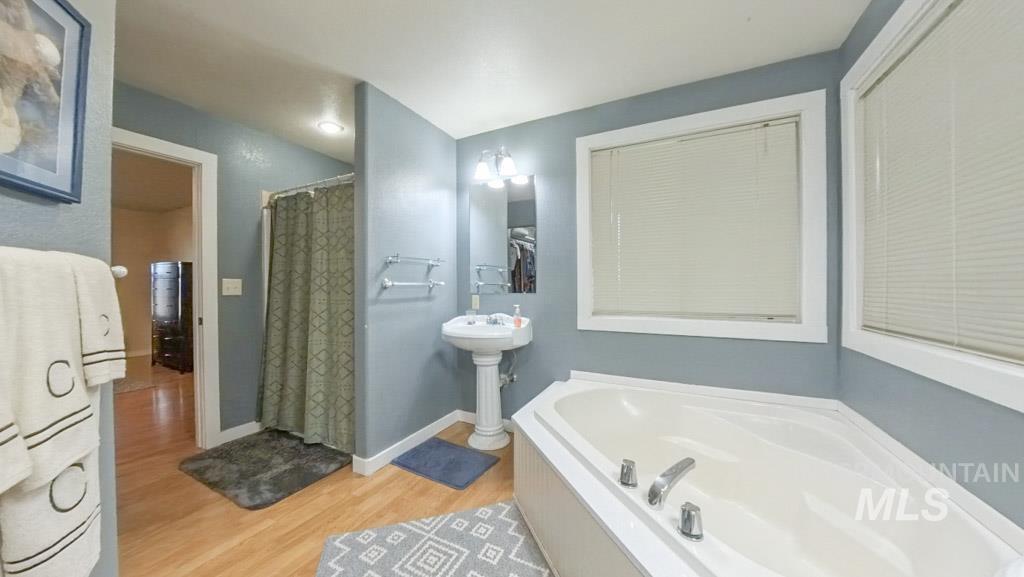 1277 Kennedy Ford Road Potlatch, ID 83855 - Photo 20 of 49 Primary suite bathroom, large walk in closet, two individual vanities, walk in shower, and a huge tub!