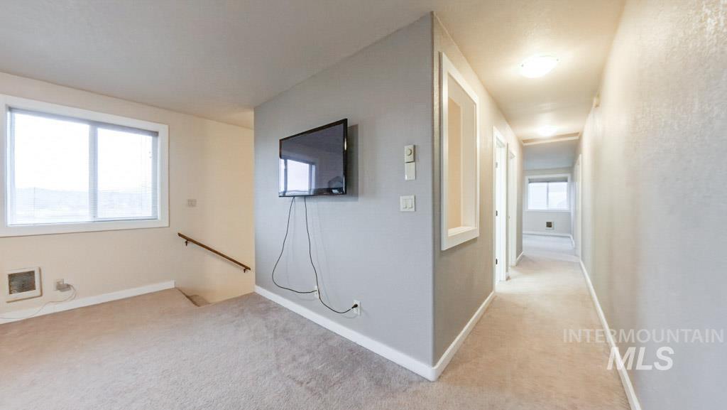 1277 Kennedy Ford Road Potlatch, ID 83855 - Photo 29 of 49 Hall leading to both bathrooms, bedrooms, and additional living space.