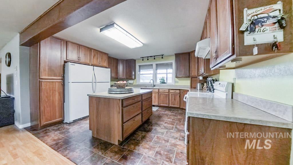 1277 Kennedy Ford Road Potlatch, ID 83855 - Photo 5 of 49 Kitchen with double refrigerators, spacious island, and plenty of counter space for homemade meals to come to life!