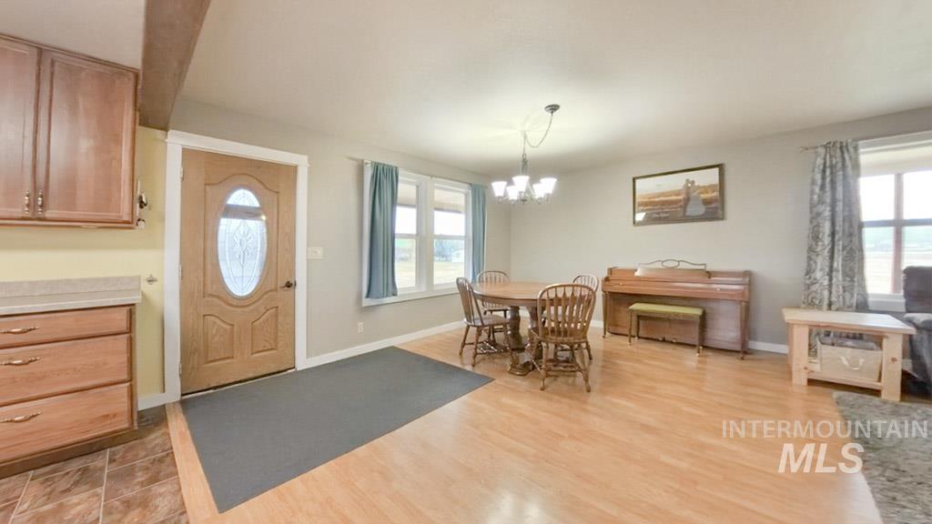 1277 Kennedy Ford Road Potlatch, ID 83855 - Photo 7 of 49 Dining area with a chandelier, and plenty of natural light.
