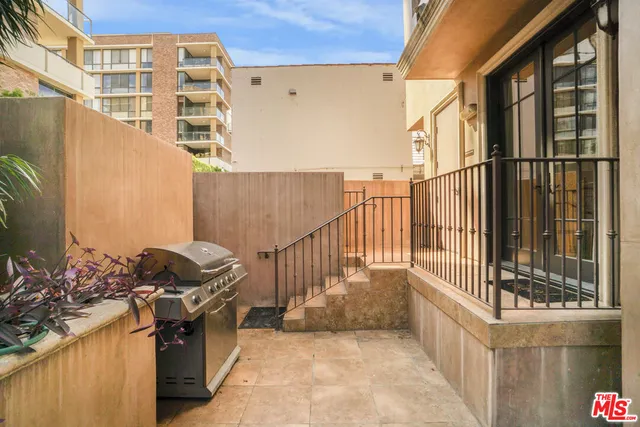a view of a back yard from a patio