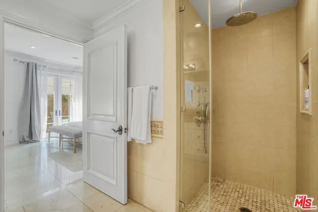 a bathroom with a glass shower door