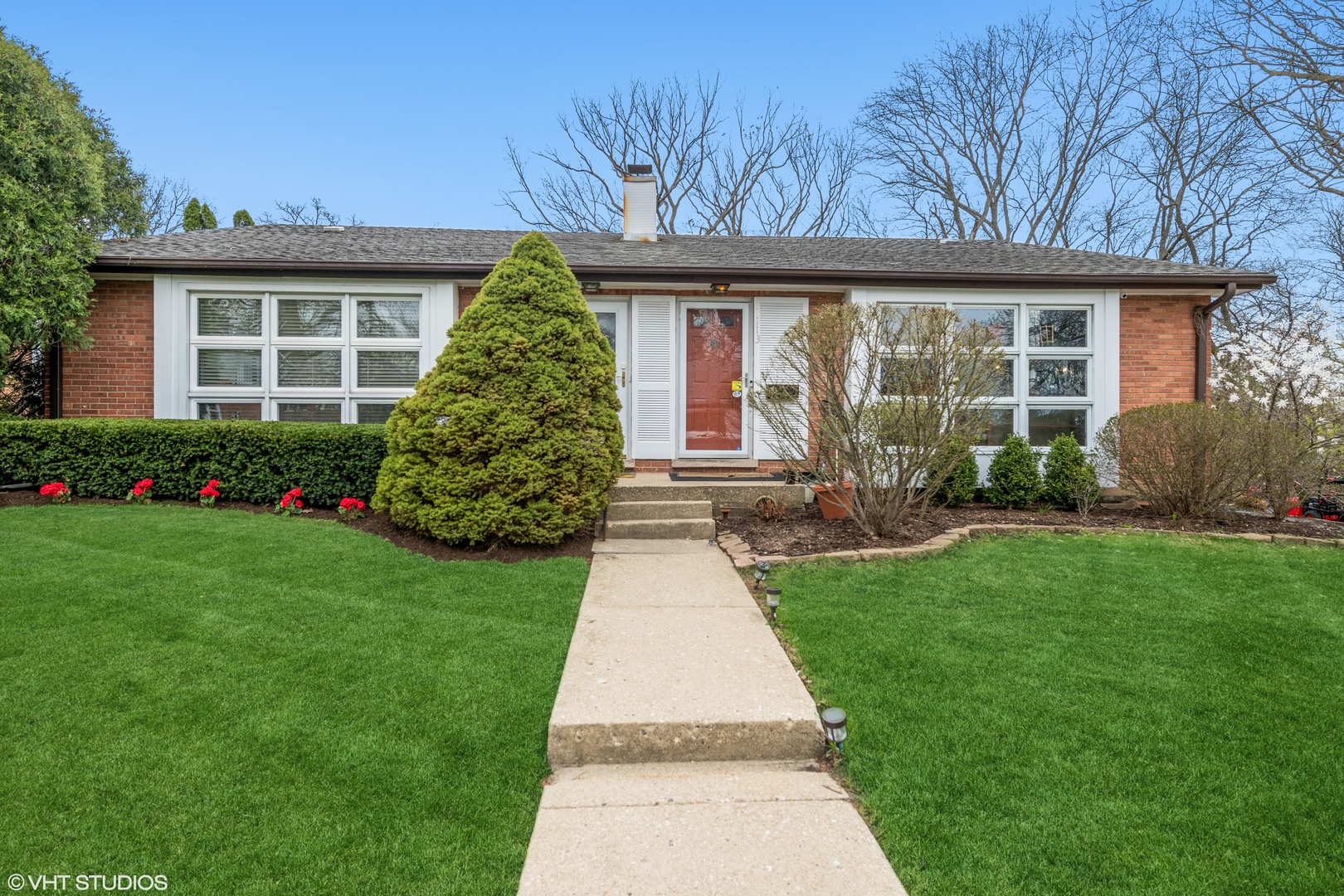 1111 Shermer Road Northbrook, IL 60062 - Photo 1 of 17 front view of a house with a yard