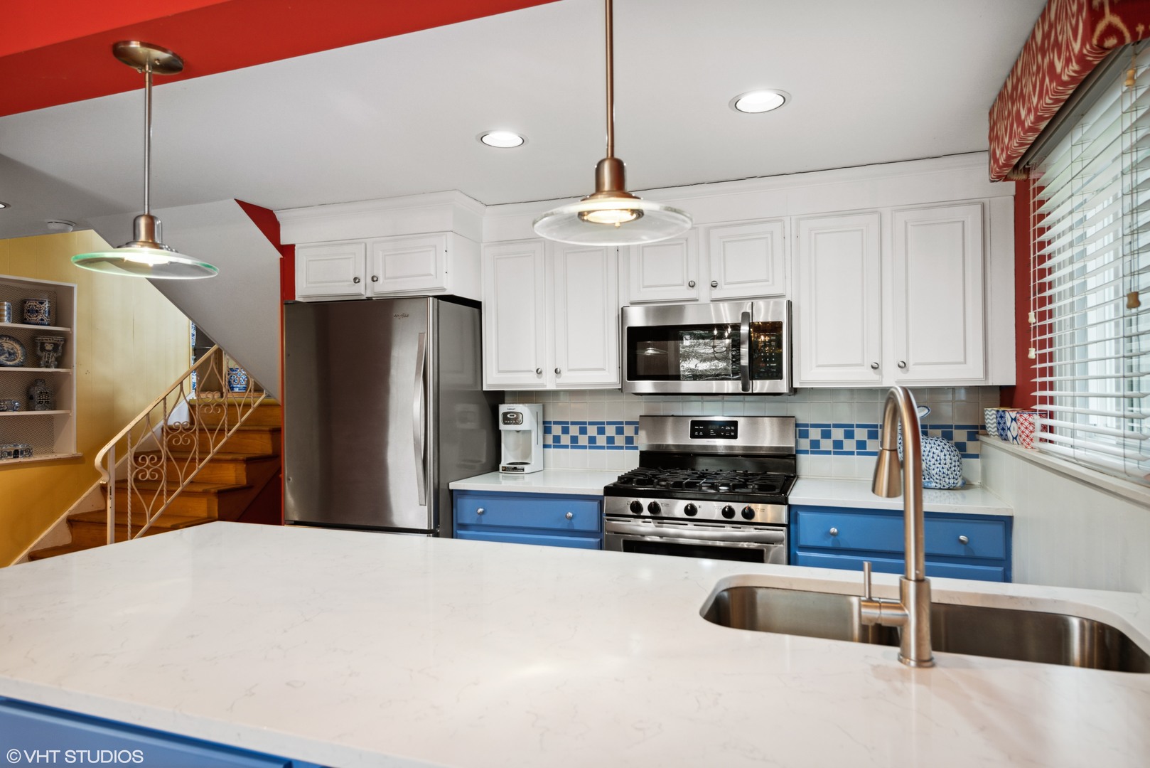 1111 Shermer Road Northbrook, IL 60062 - Photo 5 of 17 a kitchen with stainless steel appliances a refrigerator a sink a stove a microwave and island