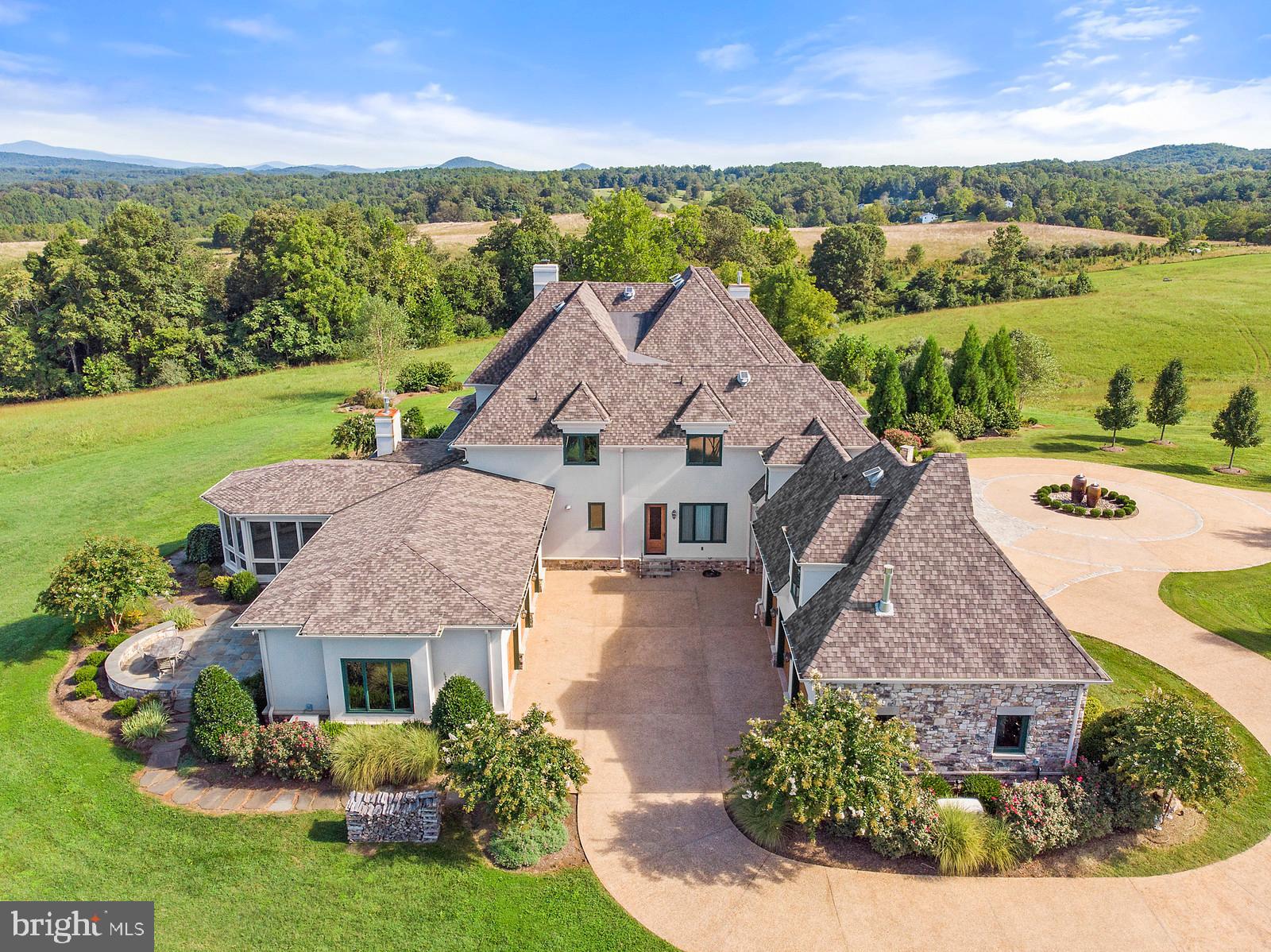 13036 Old Stillhouse Road Boston, VA 22713 - Photo 42 of 75 an aerial view of a house with a garden and lake view
