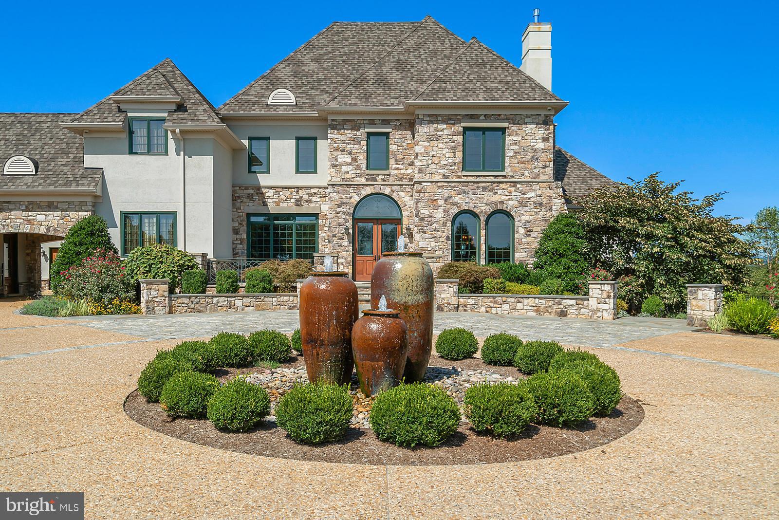 13036 Old Stillhouse Road Boston, VA 22713 - Photo 47 of 75 a front view of a house with a yard and potted plants