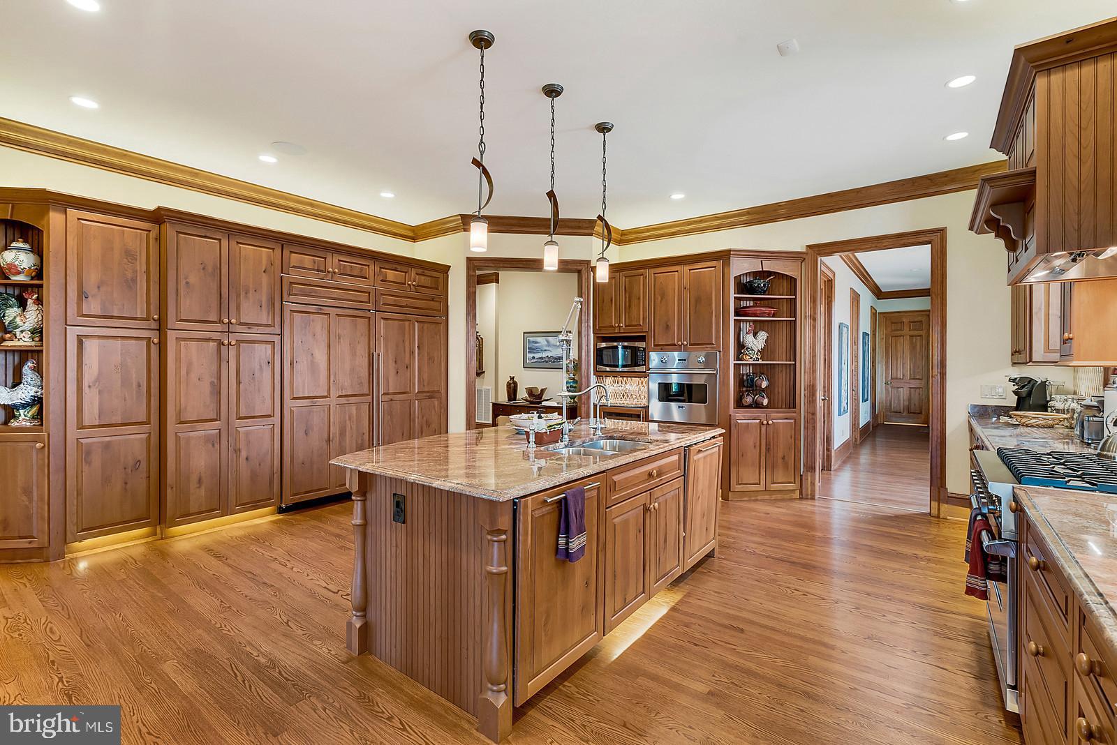 13036 Old Stillhouse Road Boston, VA 22713 - Photo 6 of 75 a kitchen with stainless steel appliances a sink stove and wooden floor