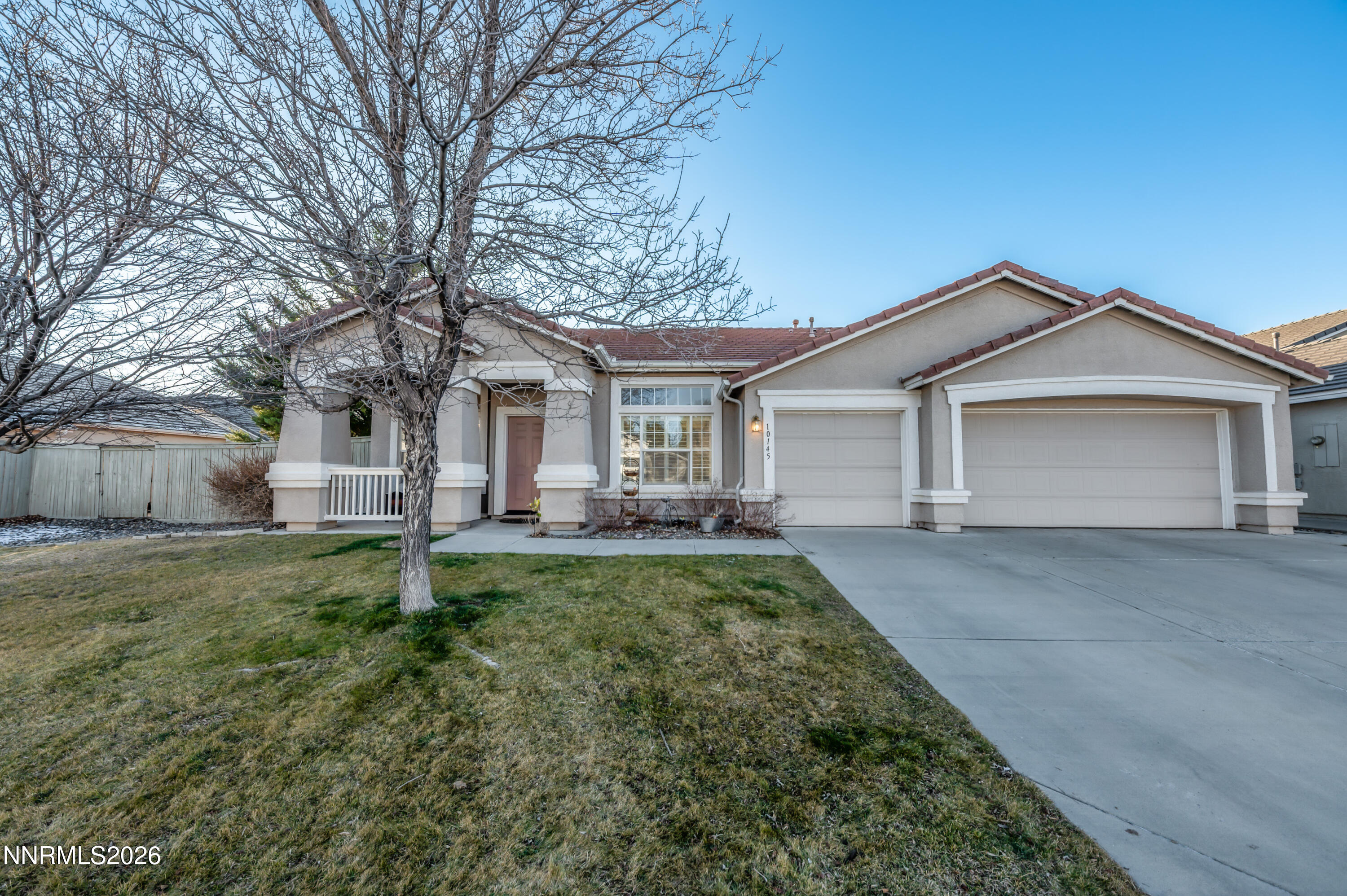 10145 Lucente Way Reno, NV 89521 - Photo 1 of 54 front view of a house with a yard