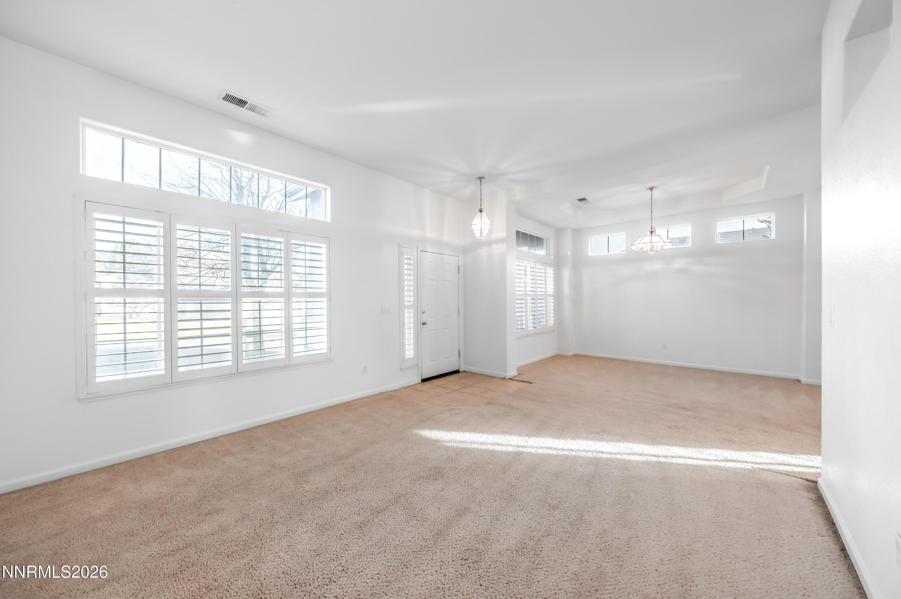 10145 Lucente Way Reno, NV 89521 - Photo 11 of 54 a view of an empty room with a window